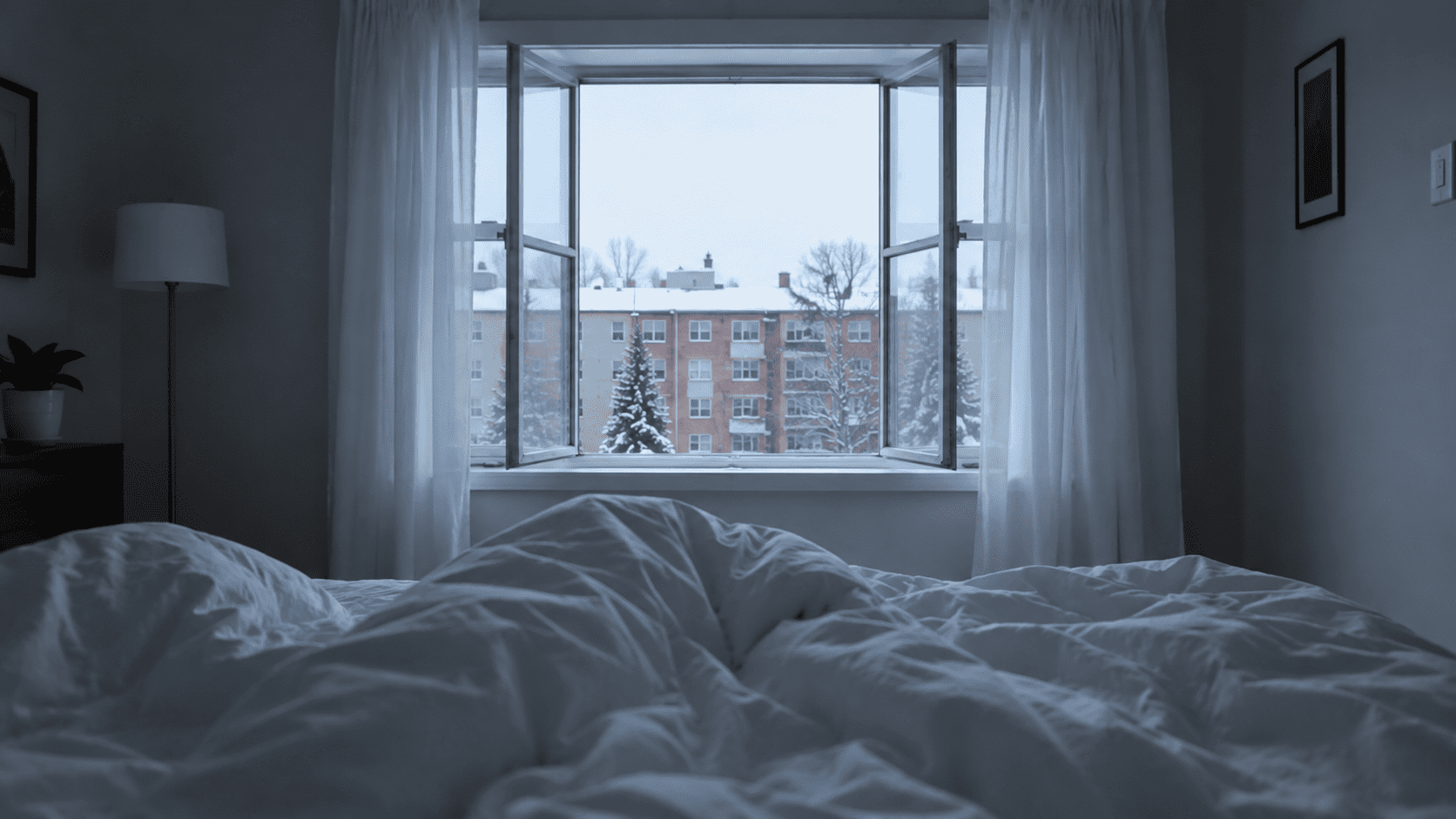 A snowy owl flying toward an open bedroom window in winter